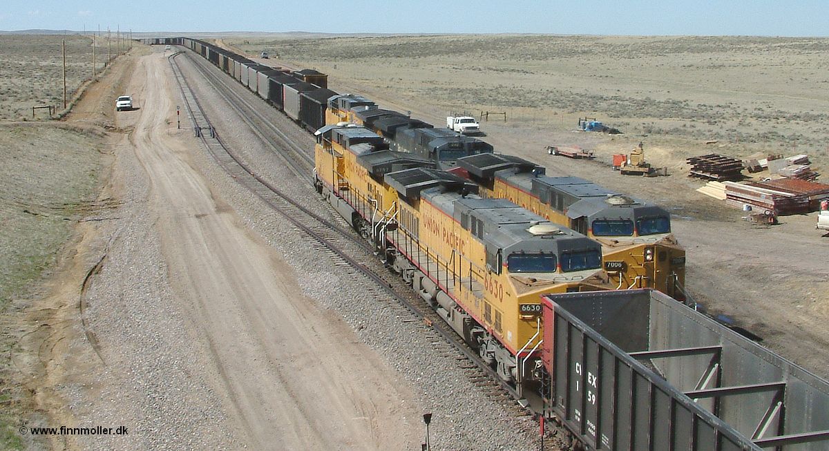 UP 6797 + 6630 is passing a southbound loaded coal train